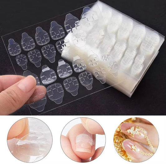 Press-on nail sticker sheets with clear backing and navy plaid nail shapes