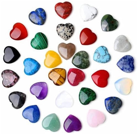 Assorted polished heart-shaped crystal stones in red, blue, purple, green, and white