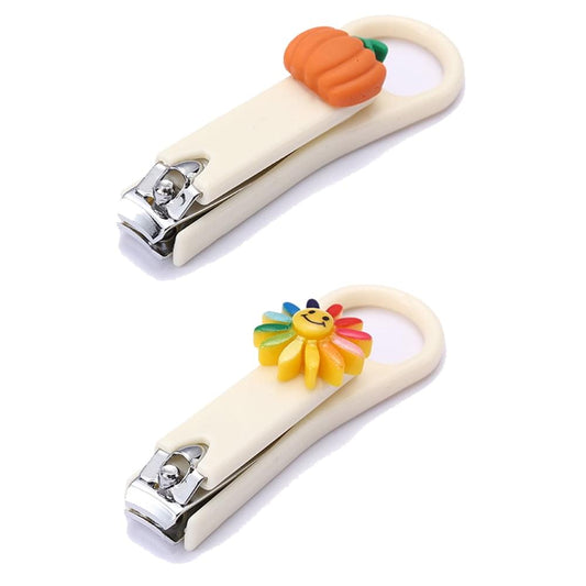 Nail clipper set with beige handles and orange and flower charms, chrome blades