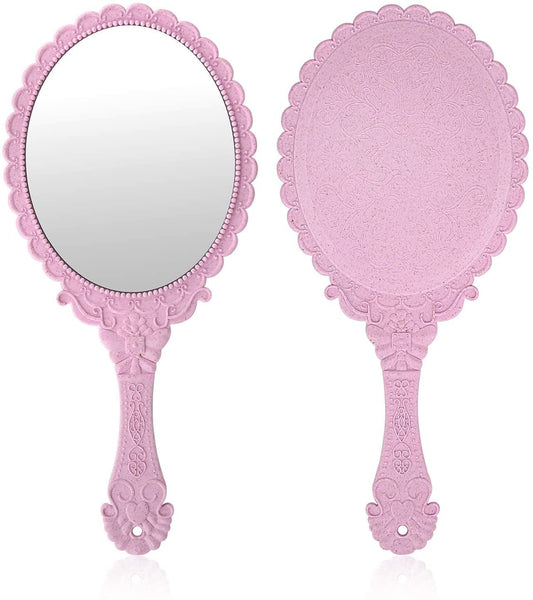 Pink handheld vanity mirror with embossed flower scalloped frame