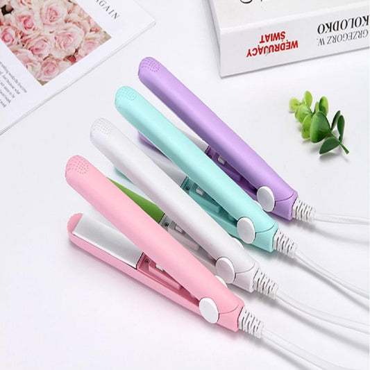 Mini 2-in-1 hair straighteners, purple, teal, and pink units on white