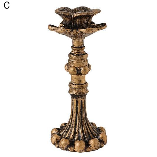 Brass gold candlestick holder with flower-like top and ribbed stem