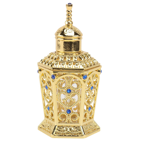 Gold glass perfume bottle with ornate filigree and blue gemstone accents