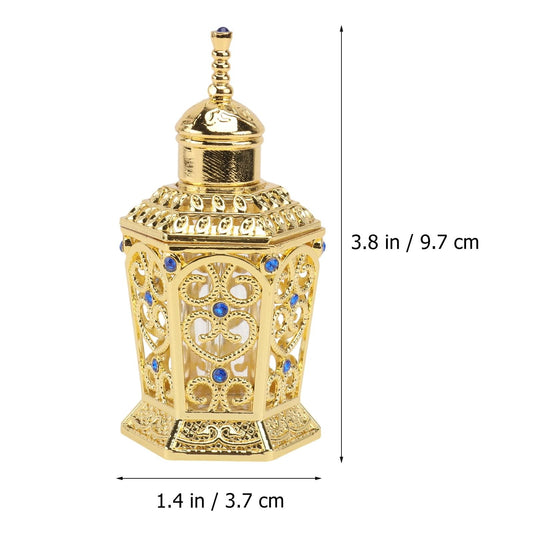 Gold glass perfume bottle with faceted lattice design and blue gemstone accents