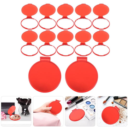Set of mini round handheld makeup mirrors with red covers and clear viewing openings