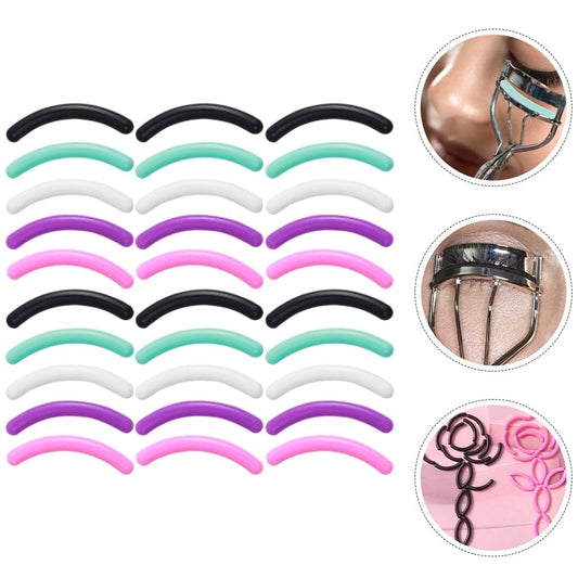 Assorted eyelash curler refill pads, curved black, white, purple and mint strips