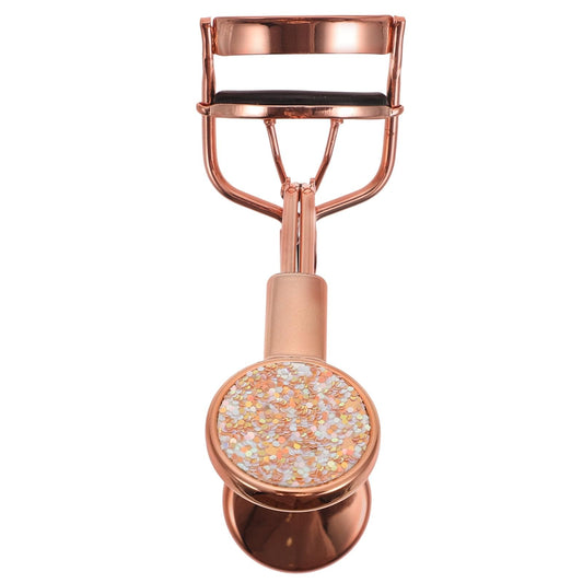 Rose gold eyelash curler with glitter pad and arched clamp handle