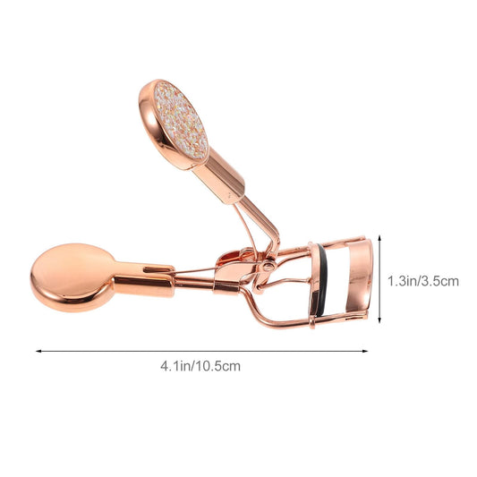 Rose gold eyelash curler with curved handle and glitter top pad
