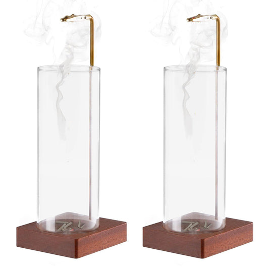 Clear glass incense stick holder with brass clip and dark wood base, removable cylinder