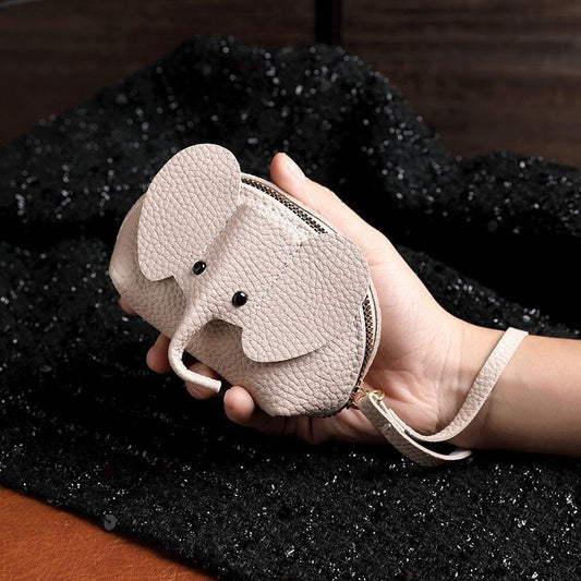 Light beige leather elephant coin purse with zip closure and wrist strap