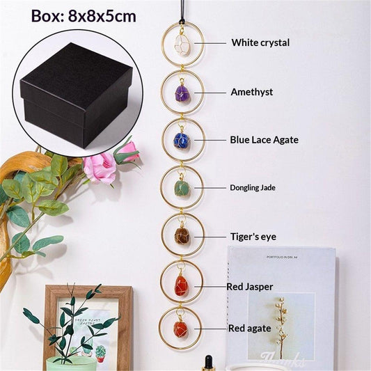 Hanging crystal ornament with gold rings and small round stones in multiple colors