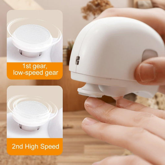 White rechargeable electric nail trimmer in hand, with filing port and side button