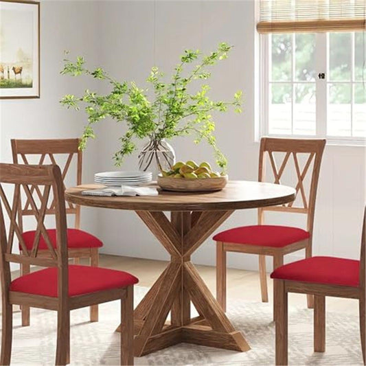 Red chair seat slipcovers on four dining chairs around round table