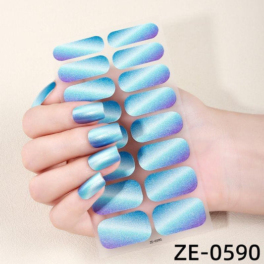 Holographic blue nail polish film stickers with glittery stripe effect on full nails