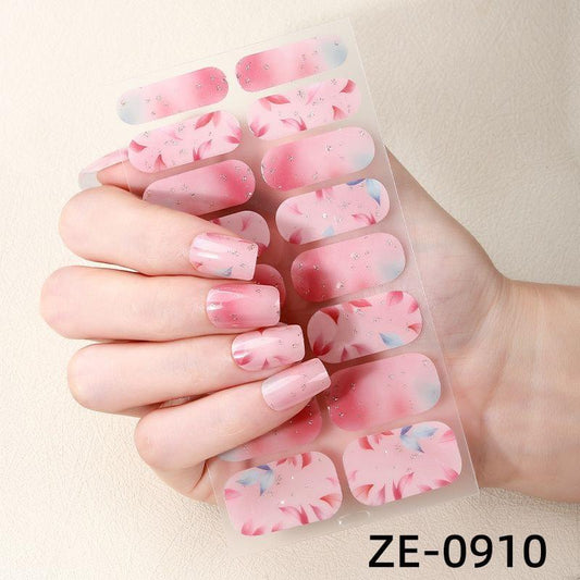 Nail stickers on sheet: glossy pink gradient nails with blue accent shapes