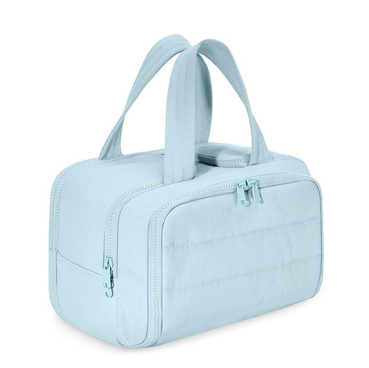 Blue large-capacity toiletry and makeup bag with zip closure and carry handles