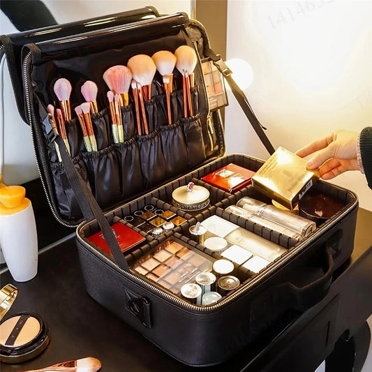 Black makeup case open with rows of brushes and organized makeup containers in inner compartments