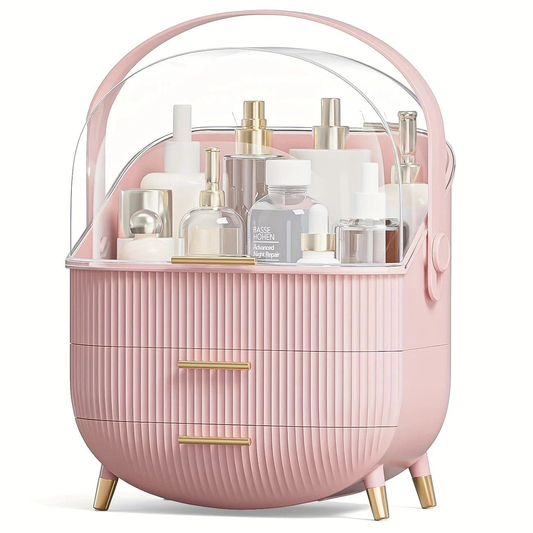 Pink ribbed makeup organizer with clear dome cover and two front drawers, supported by gold legs.