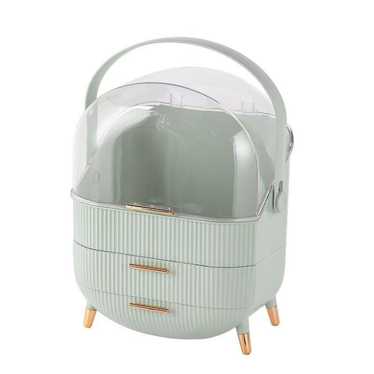 Pale green flip-top cosmetic storage box with clear dome and two drawer compartments