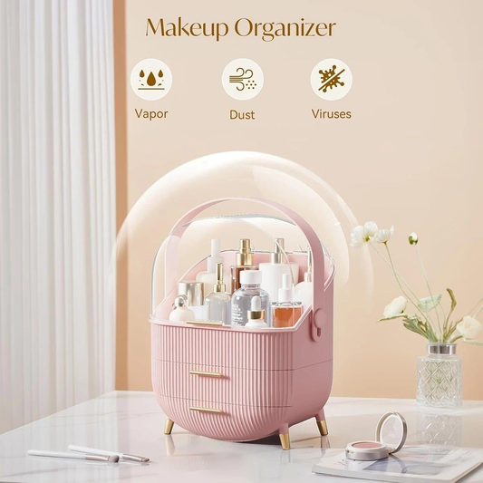 Pink makeup organizer with clear dome lid and ribbed flip-top base, two drawers