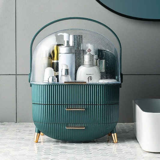 Dark green ribbed cosmetic organizer with clear flip-top lid and gold drawer handles.