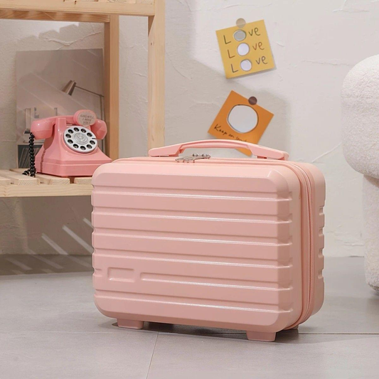 Pink ribbed mini makeup case with zip closure and top handle