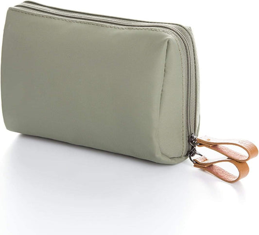 Light green waterproof makeup bag with zip top and brown leather-style wrist strap