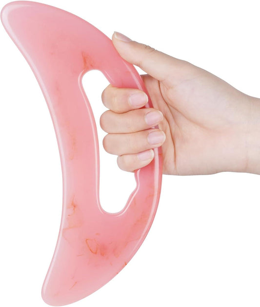 Pink gua sha massager, curved scraper with hand grip and oval cutout