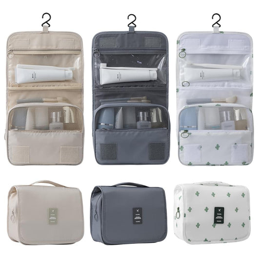Set of hanging toiletry bags in beige, blue, and white with top hooks