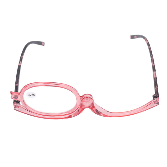Pink single-lens magnifying glasses with oval lens marked +3.00 and dark patterned temples