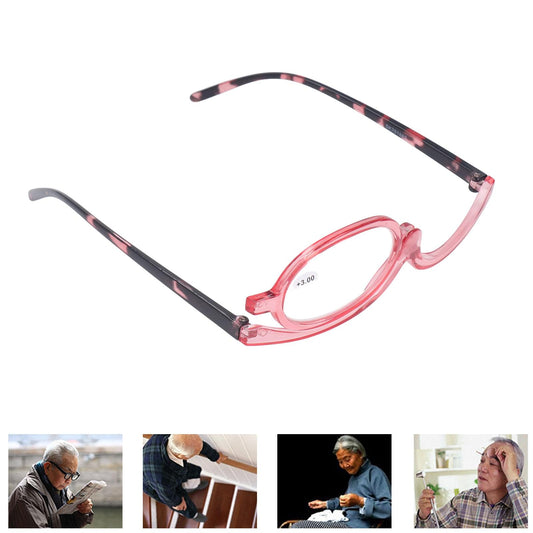Pink single-lens magnifying glasses with oval lens marked +3.00, angled view