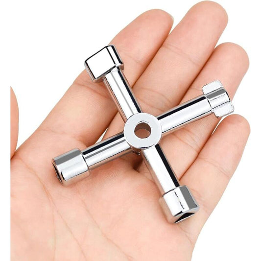 Universal multi-function wrench held in open hand, silver cross tool with sockets