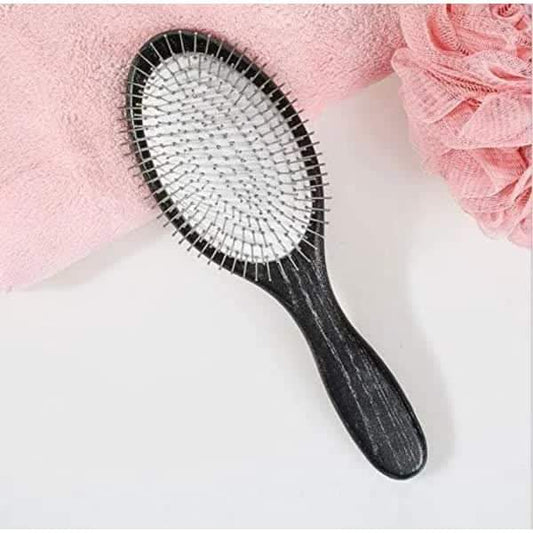 Hair paddle brush with metal spikes, black handle and white bristle pad