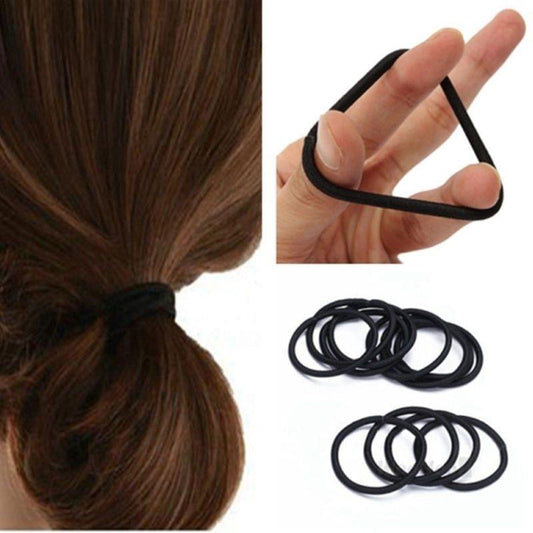 Black hair tie elastic holding a tied bun