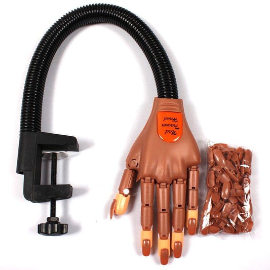 Nail practice hand with black gooseneck stand and bag of orange nail tips