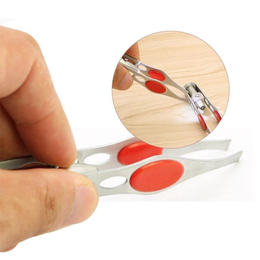 Silver LED tweezers with red oval tips, held in hand