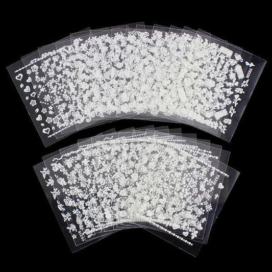 White flower nail art stickers on clear sheets, many small floral and heart decals