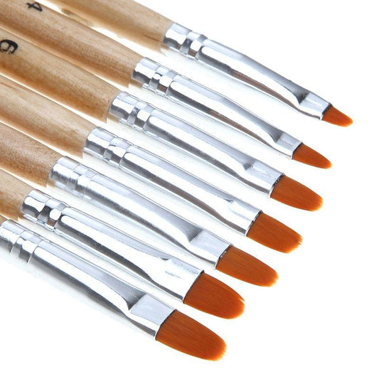 Set of nail art brushes with wooden handles and silver ferrules, orange bristles.
