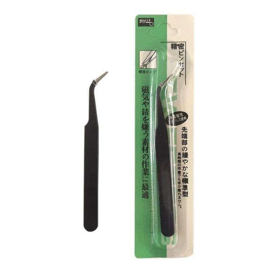 Black tweezers with metal tip on green blister card