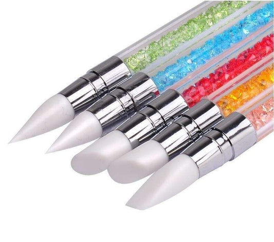 Five double-ended silicone UV nail art brushes with silver handles and white pointed ends