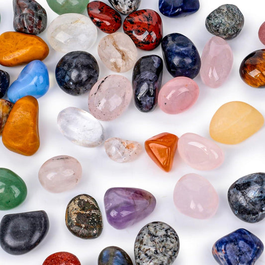 Assorted tumbled gemstones, polished smooth stones in mixed colors