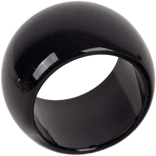 Glossy black acrylic napkin ring with round opening, close-up view.