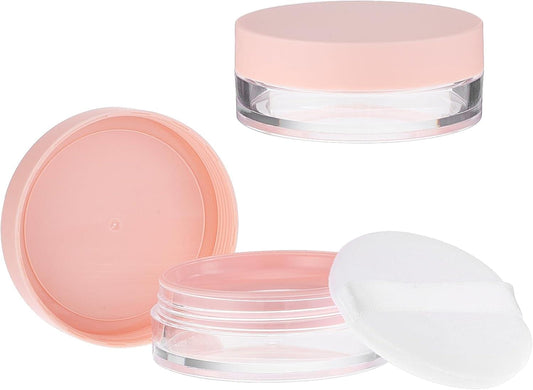 Loose powder container set with pink screw lid, sifter, puff and compact base.