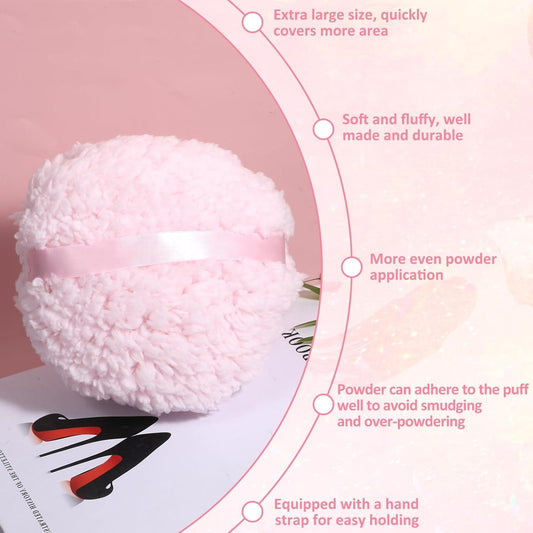 Pink fluffy plush powder puff with white strap, round face applicator close-up
