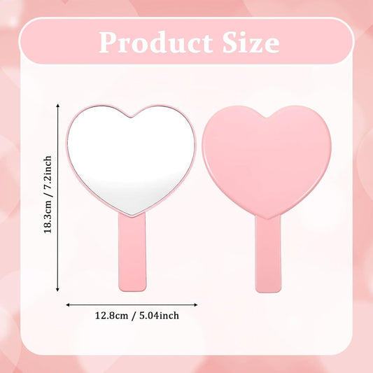 Heart-shaped handheld mirror with pink handle, front view and size diagram