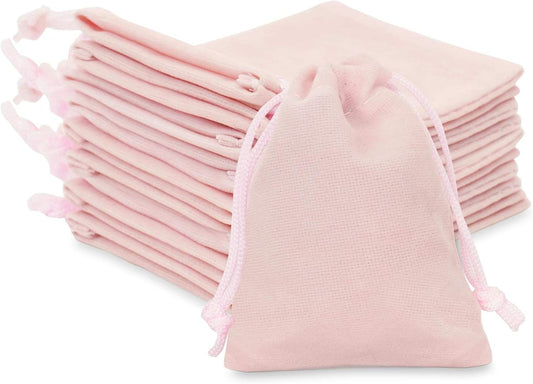 Pink velvet jewelry pouch with drawstring closure, small gift bag.