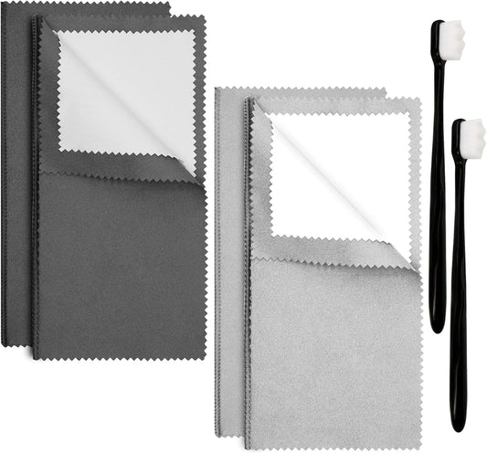 Jewelry cleaning cloths and soft brush with white bristles on a black handle.
