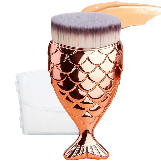 Rose gold kabuki makeup brush with mermaid scale pattern and rounded purple bristles