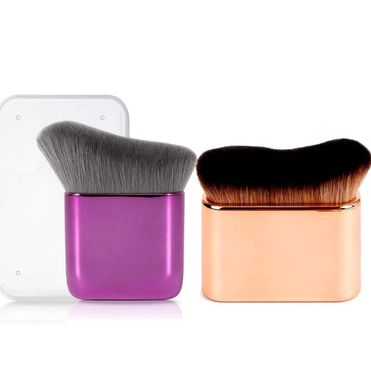 Self-tanner blending brushes, one purple and one copper with soft bristles