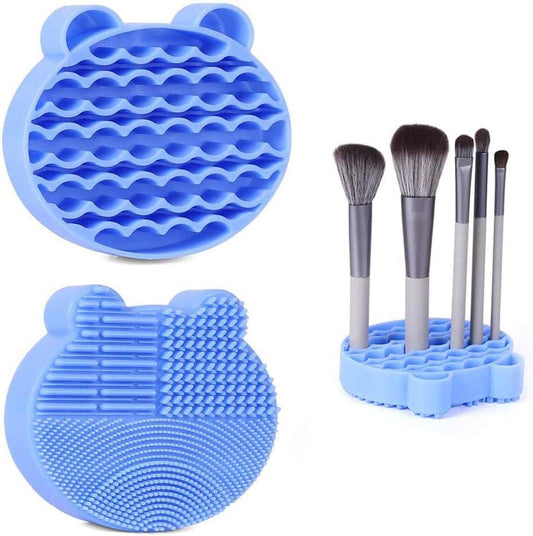 Blue silicone makeup brush cleaning mat with circular ridged surface and drying stand